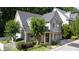 Beautiful two-story home featuring a well-manicured lawn, charming trees, and an inviting front porch at 1360 Edmund Ne Ct, Atlanta, GA 30306