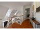 Upstairs foyer featuring hardwood floors, a modern chandelier, and plenty of natural light at 1360 Edmund Ne Ct, Atlanta, GA 30306