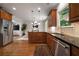 Modern kitchen with stainless steel appliances, granite countertops, and hardwood floors at 1360 Edmund Ne Ct, Atlanta, GA 30306