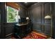Cozy office space with wood floors, dark trim, wainscoting, and a large window at 1360 Edmund Ne Ct, Atlanta, GA 30306