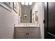 Bright powder room featuring modern fixtures, framed artwork, and a dark-colored door at 1360 Edmund Ne Ct, Atlanta, GA 30306