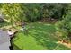 Aerial view of home showing large backyard, deck, patio seating, and play area at 151 Quail Hollow Dr, Dallas, GA 30157