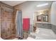 Bathroom boasts tiled shower, soaking tub, and modern fixtures at 151 Quail Hollow Dr, Dallas, GA 30157