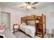 Bright bedroom with bunk beds, soft carpet, and pastel pink wall at 151 Quail Hollow Dr, Dallas, GA 30157
