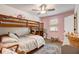 Cozy ' bedroom with a bunk bed, ceiling fan, pink accent wall, and plush decor accents at 151 Quail Hollow Dr, Dallas, GA 30157