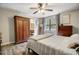 Bedroom features hardwood floors, neutral walls, and large window at 151 Quail Hollow Dr, Dallas, GA 30157
