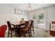 Inviting dining area with a wooden table, chairs, and french doors leading to an outdoor patio at 151 Quail Hollow Dr, Dallas, GA 30157