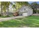 Charming home exterior featuring a well-manicured lawn, a two-car garage, and a welcoming front porch with stairs at 151 Quail Hollow Dr, Dallas, GA 30157