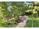 Aerial view of house shows large lot, back yard with room to play, front porch at 151 Quail Hollow Dr, Dallas, GA 30157