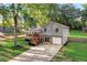 Charming home with front porch and spacious backyard, surrounded by mature trees and landscaping at 151 Quail Hollow Dr, Dallas, GA 30157