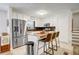 Bright, updated kitchen with stainless steel appliances, island seating, and ample counter space at 151 Quail Hollow Dr, Dallas, GA 30157