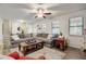 Spacious living room with hardwood floors, a fireplace, and comfortable seating arrangements at 151 Quail Hollow Dr, Dallas, GA 30157