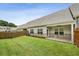 Large, grassy backyard offers ample space and wooden fencing at 1637 Short Shadow Ln, Snellville, GA 30078