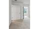 Carpeted bedroom with white walls features a full-length door leading into a tiled bathroom at 1637 Short Shadow Ln, Snellville, GA 30078