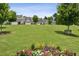 A beautiful landscaped community with lush green lawn and colorful flower beds at 1637 Short Shadow Ln, Snellville, GA 30078