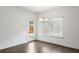 Dining room with hardwood floors, natural light and backyard door to the exterior at 1637 Short Shadow Ln, Snellville, GA 30078
