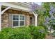 Inviting home entrance with brick accents, decorative shrubs, and a stylish front door at 1637 Short Shadow Ln, Snellville, GA 30078