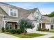 Attractive townhomes show stone accents, manicured lawns, and flowering trees at 1637 Short Shadow Ln, Snellville, GA 30078