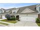 Beautiful home showcases stone accents, well-manicured landscaping, and a convenient two-car garage at 1637 Short Shadow Ln, Snellville, GA 30078