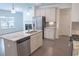 Modern kitchen with stainless steel appliances, granite countertops, and hardwood floors at 1637 Short Shadow Ln, Snellville, GA 30078