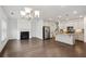 Open-concept kitchen seamlessly transitions to a bright living area with a fireplace at 1637 Short Shadow Ln, Snellville, GA 30078