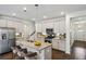 Bright kitchen with a center island, stainless steel appliances, and white cabinetry at 1637 Short Shadow Ln, Snellville, GA 30078