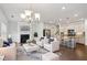Bright living room featuring a fireplace, hardwood floors, and lots of natural light at 1637 Short Shadow Ln, Snellville, GA 30078