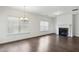 Spacious living room with hardwood floors, fireplace, and bright natural light at 1637 Short Shadow Ln, Snellville, GA 30078