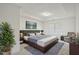 Tranquil main bedroom with tray ceiling, large windows, and elegant furnishings at 1637 Short Shadow Ln, Snellville, GA 30078