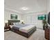 Serene bedroom featuring a king bed with storage and a tray ceiling for added elegance at 1637 Short Shadow Ln, Snellville, GA 30078