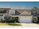 Charming townhome with stone accents, attached garage, well-maintained lawn and landscaping at 1637 Short Shadow Ln, Snellville, GA 30078