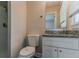 Bright bathroom features a shower with vanity and granite countertop at 2839 Long Way, Decatur, GA 30032