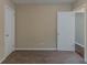 Cozy bedroom with neutral carpet, closet, and entry door at 2839 Long Way, Decatur, GA 30032