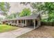 Inviting home with a covered carport, red front door, and charming front porch at 2839 Long Way, Decatur, GA 30032