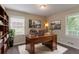 Cozy home office with built-in bookshelves, a classic desk, and serene natural light at 2839 Long Way, Decatur, GA 30032