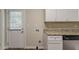 Well-lit kitchen area with modern appliances, granite countertops, and convenient back door access at 2839 Long Way, Decatur, GA 30032