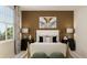 Beautifully decorated bedroom with a neutral color scheme, striking artwork, and stylish bedside tables with lamps at 1924 Logan Se Ln, Conyers, GA 30094