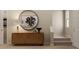 Inviting foyer with stylish wood console table, decor, mirror and staircase access at 1924 Logan Se Ln, Conyers, GA 30094