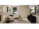 Bright living room featuring a comfortable sofa, modern decor, and a stylish entertainment center at 1924 Logan Se Ln, Conyers, GA 30094