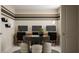 Modern home office featuring a central table, stylish chairs, and minimalist decor creating an elegant workspace at 1924 Logan Se Ln, Conyers, GA 30094