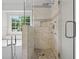 Bathroom showing the shower with tile surround and tub with chrome fixtures at 200 Creek Run Ct, Alpharetta, GA 30005