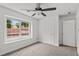 Bright bedroom features a ceiling fan and large window offering plenty of natural light at 200 Creek Run Ct, Alpharetta, GA 30005