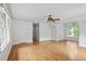 Spacious living area featuring hardwood floors and large windows providing ample light at 200 Creek Run Ct, Alpharetta, GA 30005