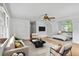 Open concept living room featuring modern furniture and a flatscreen TV at 200 Creek Run Ct, Alpharetta, GA 30005