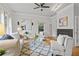 Bright living room with stylish furnishings, a cozy fireplace, and large windows that illuminate the area at 200 Creek Run Ct, Alpharetta, GA 30005