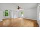 Spacious living area featuring hardwood floors and large windows providing ample light at 200 Creek Run Ct, Alpharetta, GA 30005