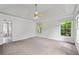 Bedroom with carpet floors, neutral walls, recessed lighting, and windows to the wooded outdoors at 200 Creek Run Ct, Alpharetta, GA 30005