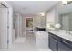 Luxurious bathroom with a soaking tub, separate shower, double vanity, and marble floors at 2720 Garonne Way, Cumming, GA 30041