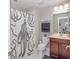 Charming bathroom with a unique octopus-themed shower curtain and modern fixtures at 2720 Garonne Way, Cumming, GA 30041