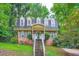 Charming brick home with a welcoming entrance and lush green surroundings at 2867 Holly Oaks Dr, Marietta, GA 30062